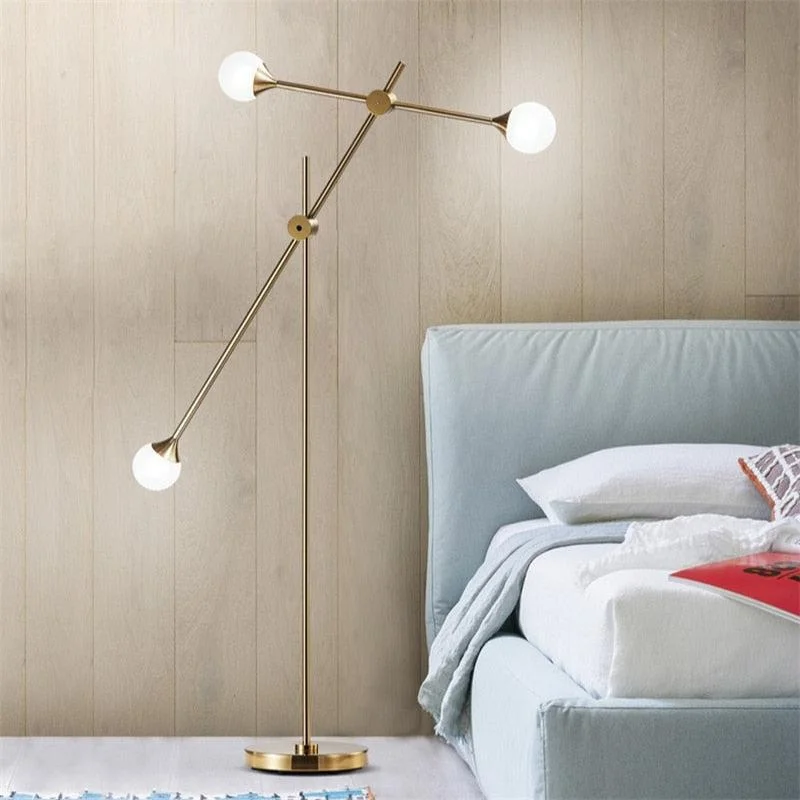 Daylight white Edison light bulbsThree Bulb Dynamic Floor Lamp in Brass