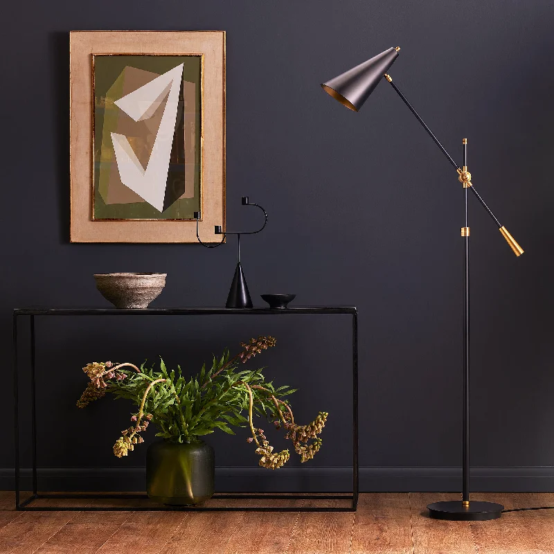 Industrial Style Floor Lamp with Exposed Bulbs for Loft ApartmentsIndustrial Style Floor Lamp with Exposed Bulbs for Loft ApartmentsMo floor lamp in antiqued brass with a black hood